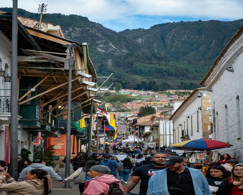 Colombian street with pedestrians walking lightly